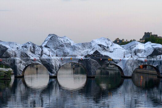 
        Street Artist JR Installs an Inflatable Cave on Paris' Pont Neuf in Tribute to Christo and Jeanne-Claude
      