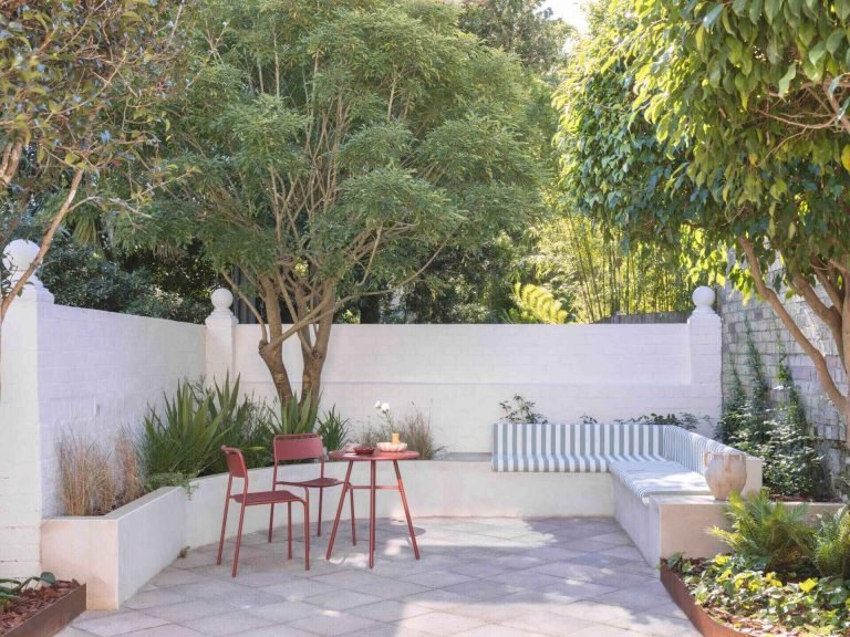 A Courtyard Makeover Filled With Curves, Reclaimed Materials, And Greenery
