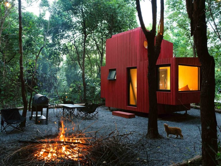 Wiki World Creates a Playful Red Cabin Inspired by a Submarine