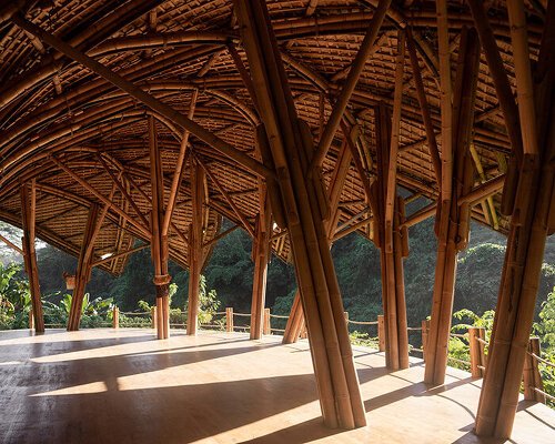 lotus-shaped bamboo roof floats over pablo luna studio’s yoga space in bali