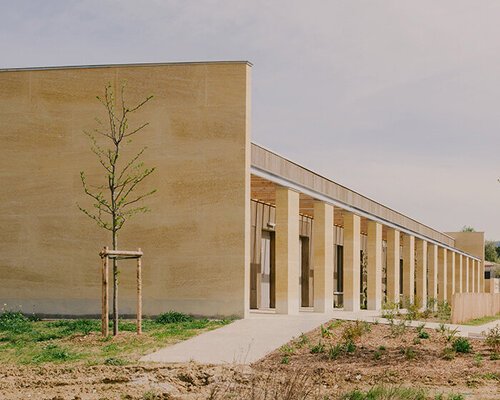 mineral stone wall enclosure frames tectoniques’ cultural center in france
