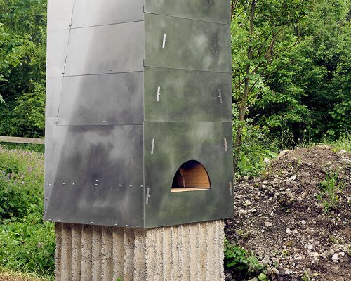 concrete, firebrick, and steel form community oven in the alpine landscape