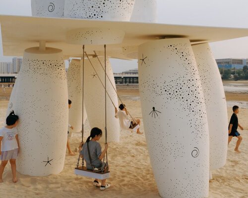 white stainless-steel cylinders form coral-like swing installation on chinese coast