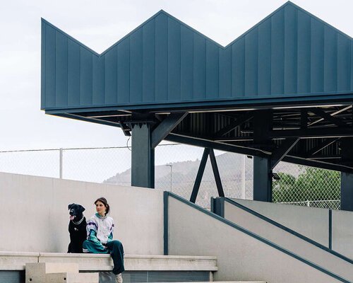 ribbed lime-green gateway and blue solar canopy reform municipal sports center in murcia