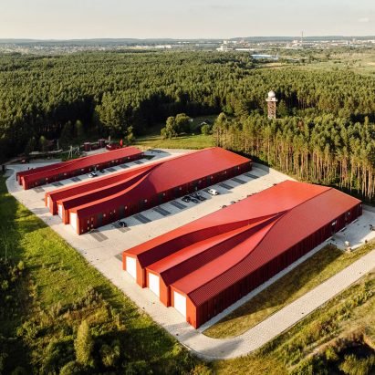 Sweeping roofs top bright red logistics hub in Ukraine by Aranchii Architects