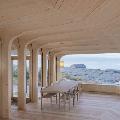 Helen & Hard uses uprooted spruce trees to shape Norwegian cabin