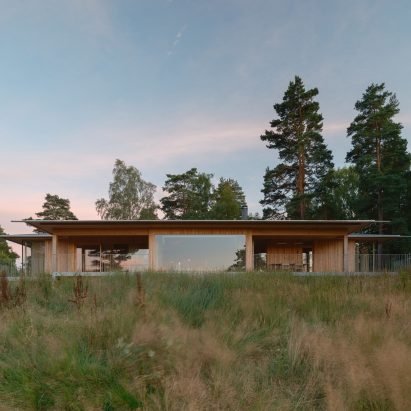 Johan Sundberg Arkitektur nestles timber summer house within Swedish woodland