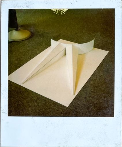 Cardboard mockup for a super graphic gilded sunburst designed by Michael Manwaring