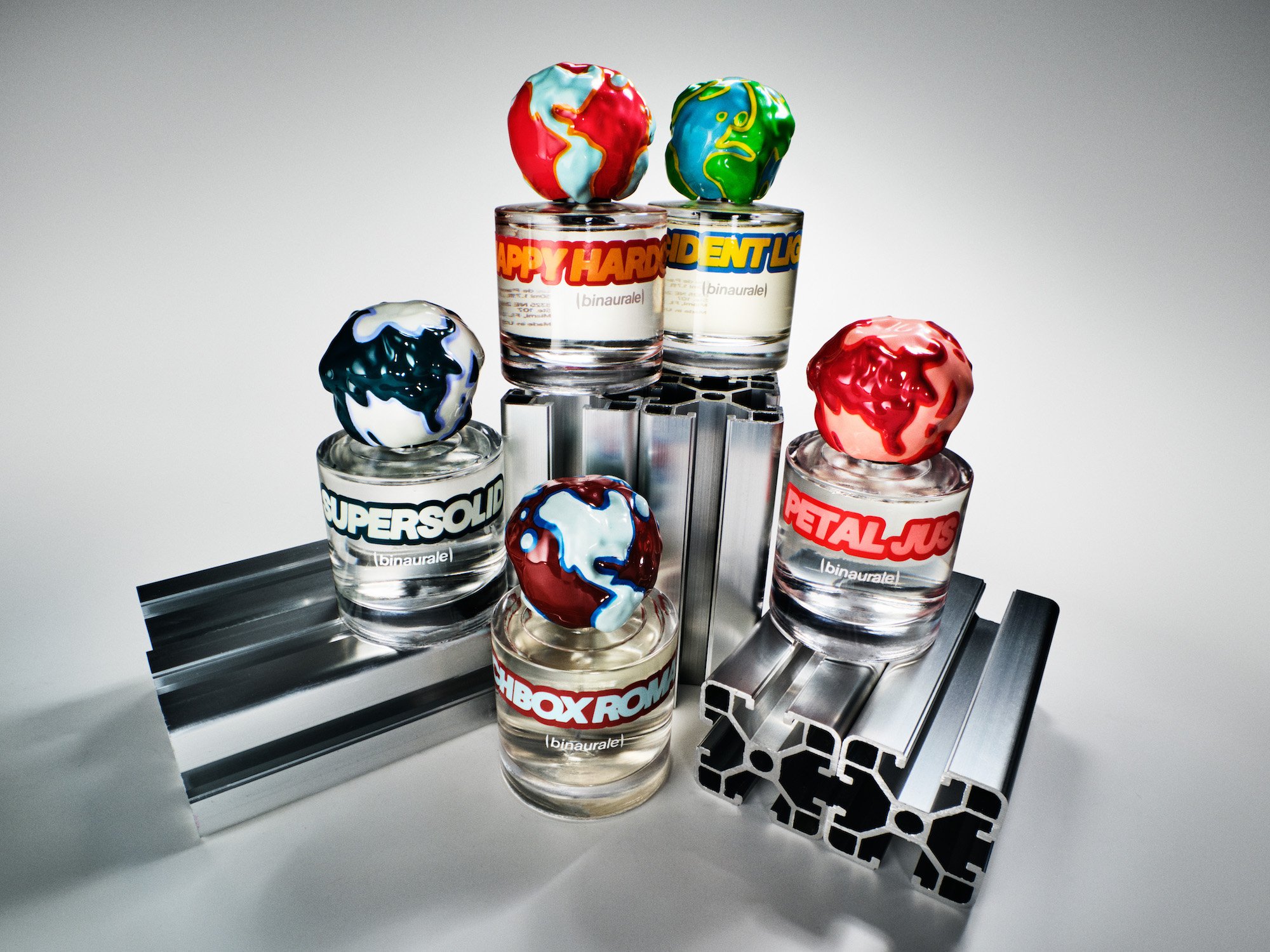 Binaurale Goes For Contained Maximalism With Globe-Capped Perfume Bottles
